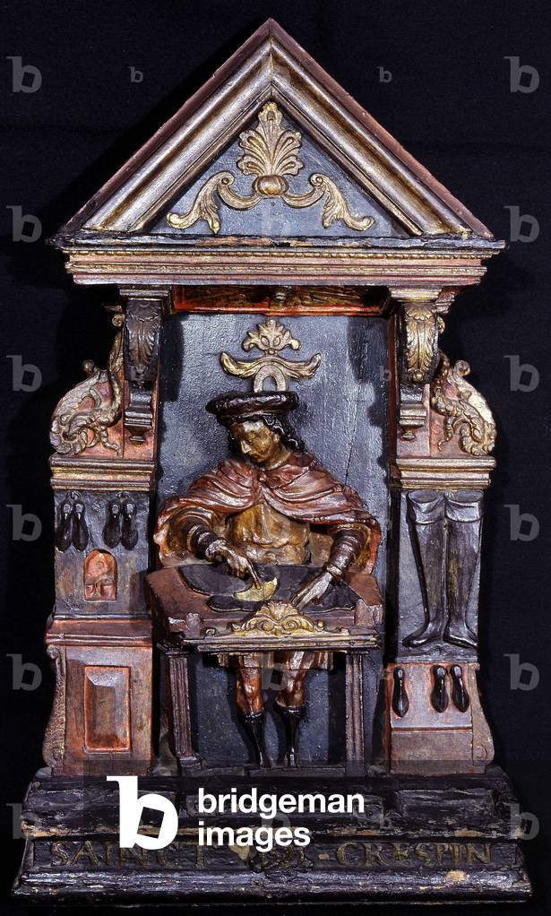 Shoemaker sign with the inscription at the bottom “” Saint Crespin”” - carved wood, 1523. Musee Carnavalet.