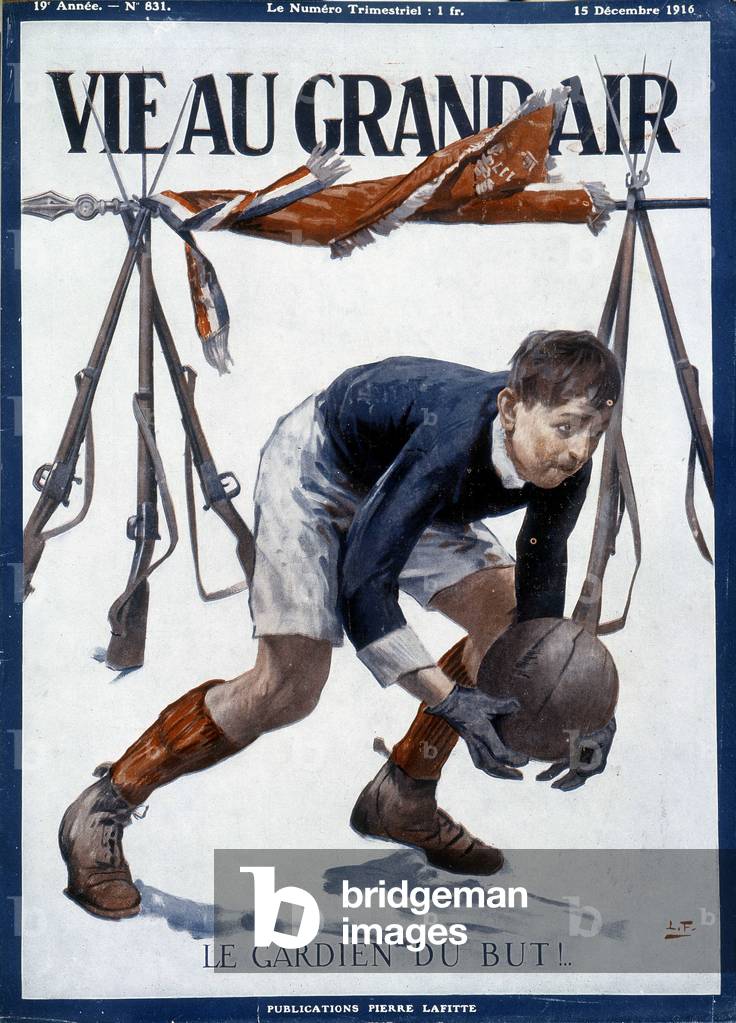 Football goalkeeper in front of makeshift goals made with bayonets and a flag - in 