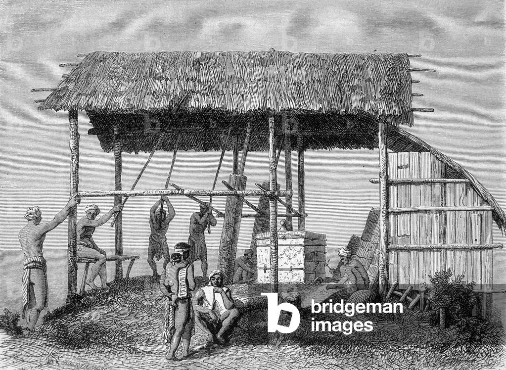 Illustration published in the 1862 edition of “Le Tour du monde” depicting a blacksmith in the dayaks on the island of Borneo. Engraving.