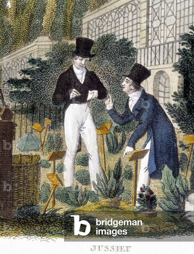Two school students studying plants in the Jardin des Plantes in Paris.