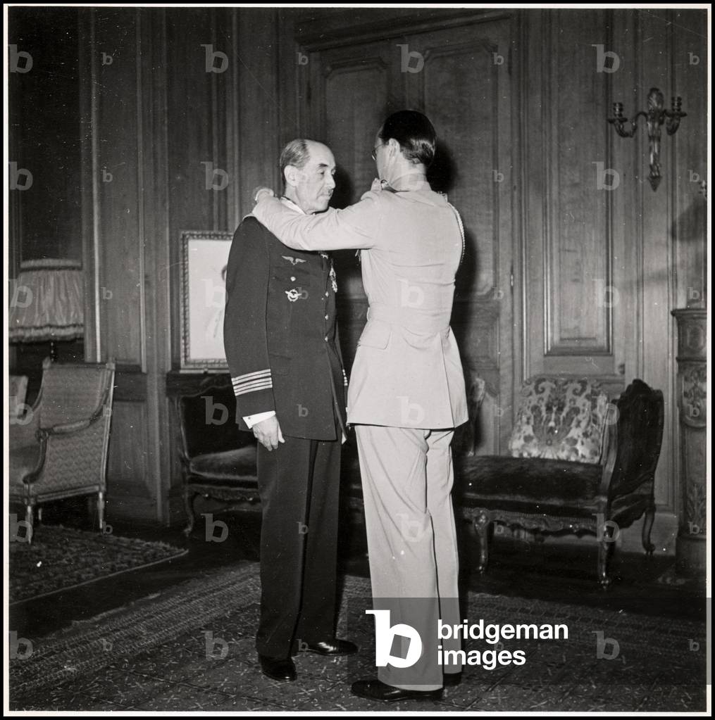 Presentation of the Commander's Cross of the Order of Orange Nassau by Prince Bernard of Holland (Bernhard Leopold zur Lippe Biesterfeld, 1911-2004) to Colonel Levy, of the Air Force, at the Embassy of Holland in Paris. Photography 5/07/1946.