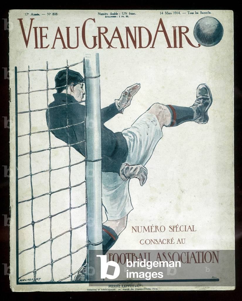 Football goalkeeper pushing back a ball in front of his cage - in 