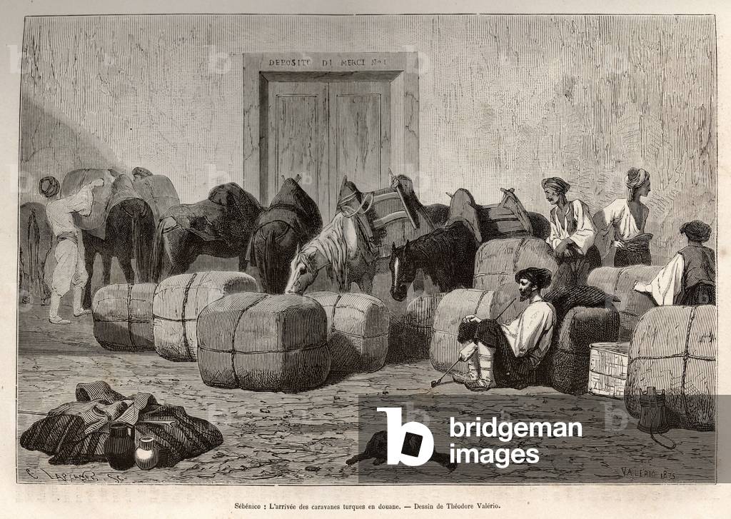 When Turkish caravans arrive at Sebenico Customs (Serbia), commercial travellers unload the bales from the back of their camels in order to verify the quantity and nature of the goods. Engraving after the drawing of Theodore Valerio, to illustrate a story about Dalmatia, by Charles Yriarte, in 1874, published in “” Le tour du monde””” 1876, edited by Edouard Charton, Hachette edition, Paris. Selva Collection.