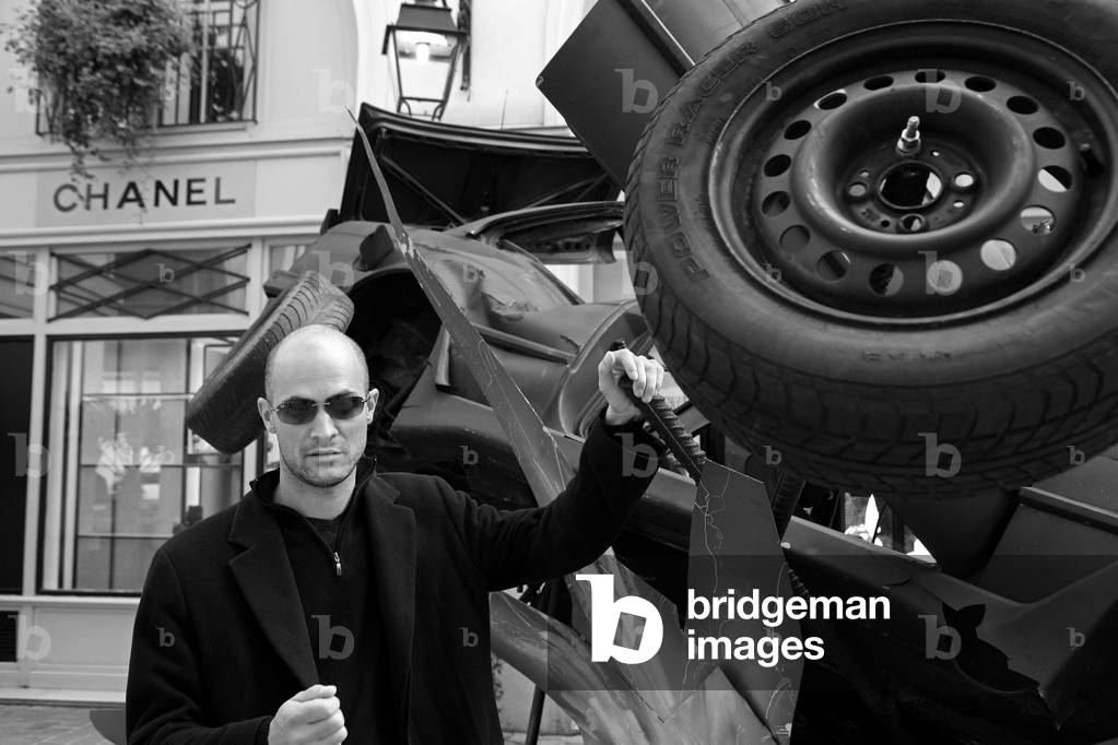 Stephane Pencreac'h, French painter, near his sculpture Katharsis for the masses. Village Royal, rue Royale in Paris on October 22, 2009.