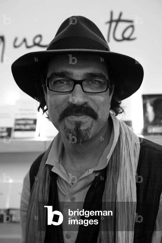 Portrait of Atiq Rahimi, French writer, Prix Goncourt 2008. Salon du Livre de Paris, 2009.