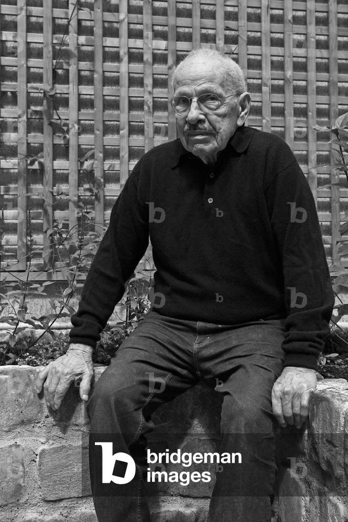 Portrait of Charles Semser, American sculptor, in the courtyard of his studio in Paris in 2008.