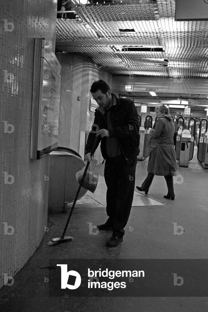 Portrait of Lionel Sabatte, French painter, during his collection of sheep (piles of dust and hair that he uses in the composition of his works) at the RATP station Les Halles in Paris in 2008.