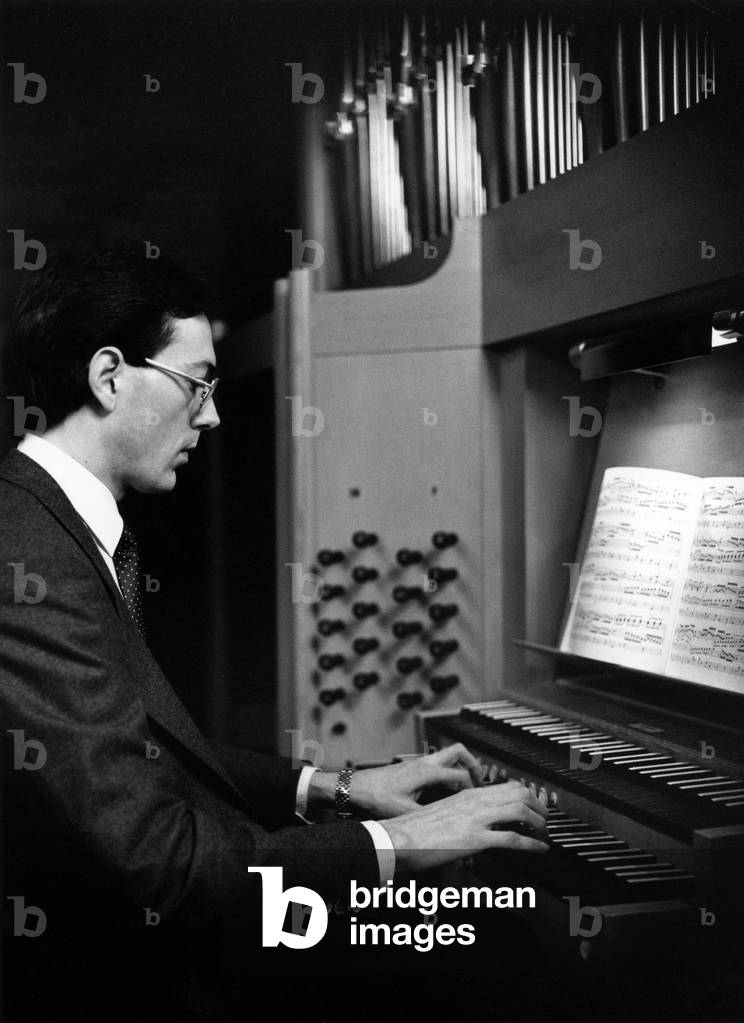 Christopher Stokes playing the organ, 1983