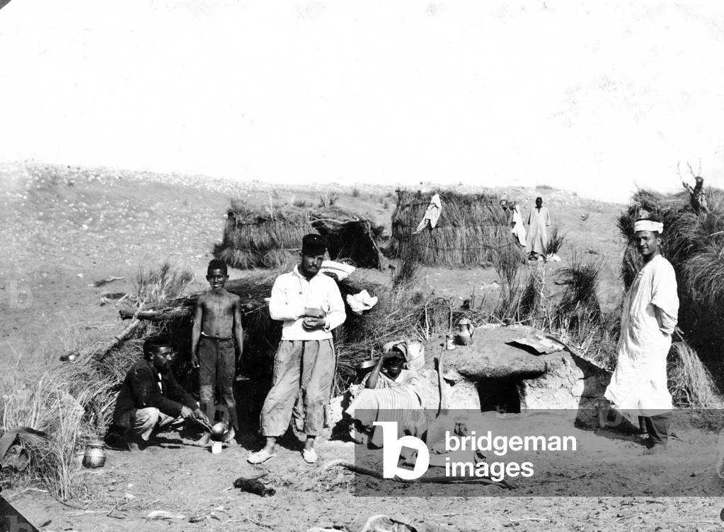 Beni Abbes, Algeria: A French soldier comes to drink the tea in an Algerian family living in a gourbi, 1895