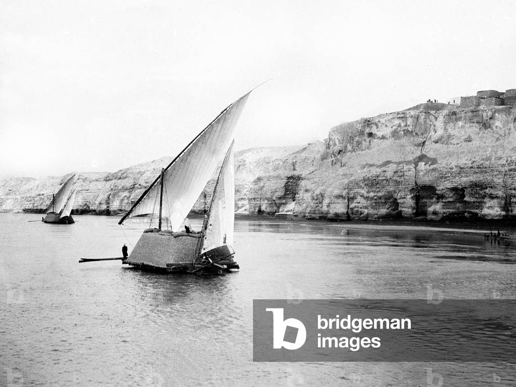 Egypt: Cook cruise, Nile side, convoy of transport felouques along the cliff bordering the Nile, 1900