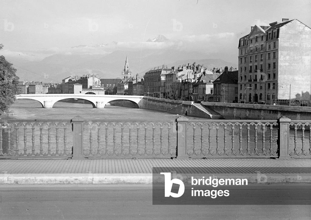 France, Rhone-Alpes, Isere (38), Grenoble: view of a bridge with mountains in the clouds, 1935 Photography