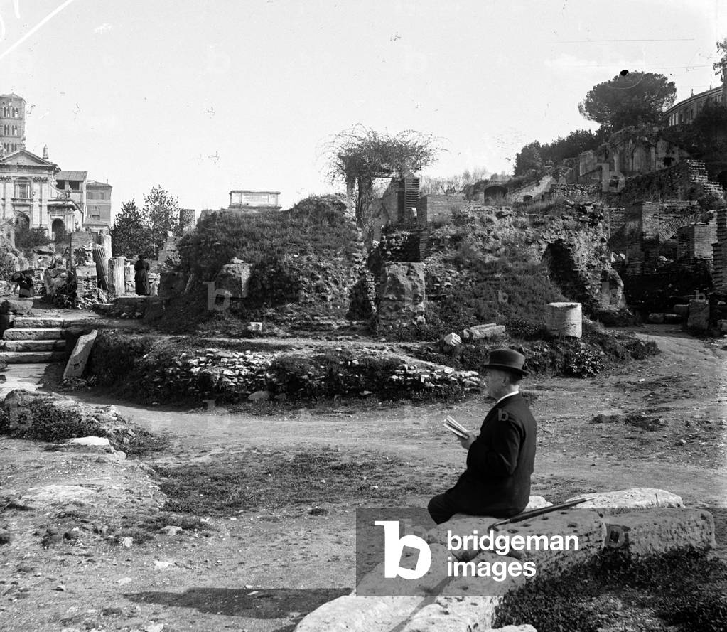 Italy, Rome: The Forum, a tourist reads the history of Rome while contemplating the ruins, 1895