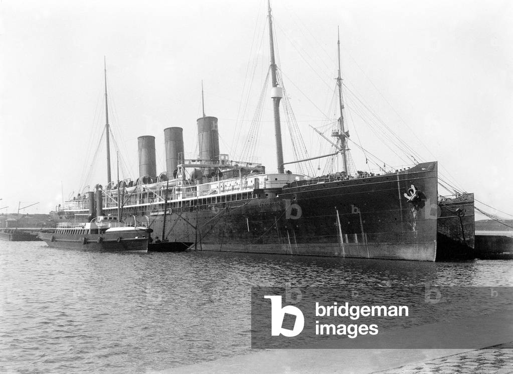 View of a three-chimney liner with tug, 1890