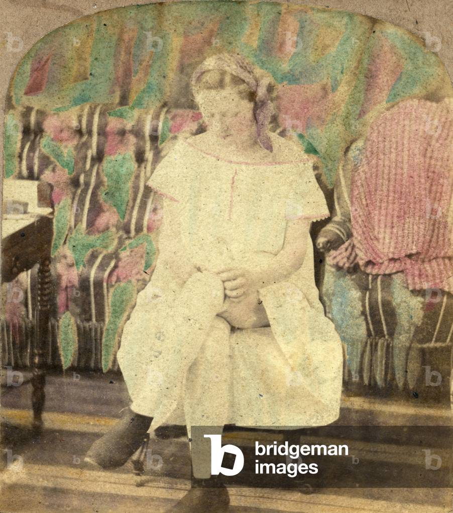 Colorful photo of a genre scene showing a girl wearing her stockings, 1866