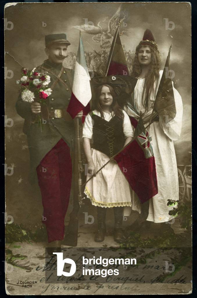 First World War: France, A French soldier brings a bouquet of flowers to two young girls representing Alsace and Lorraine who hold the flag of the alliance, 1916