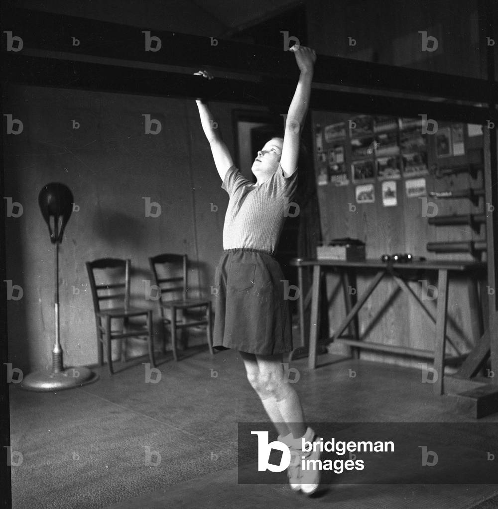 France: gym, girl with parallel bars, 1935