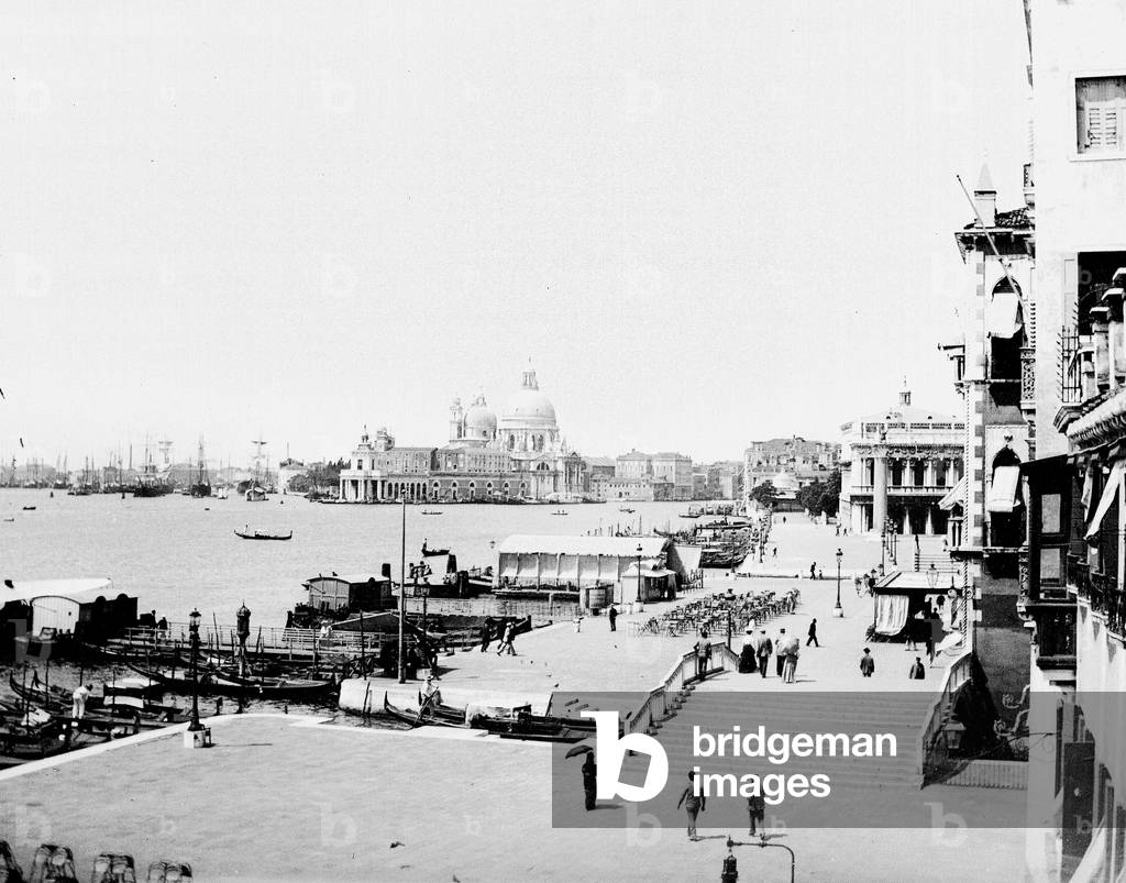 Italy, Venetie, Venice: Riva Degli Schiavoni, Church of Salute, animated view with gondolas, tourists and sailboats at anchorage, 1895