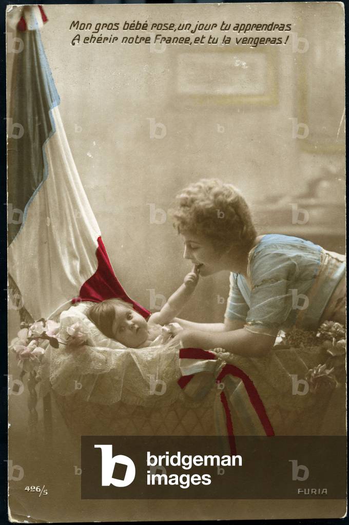 First World War: France, Patriotic Map showing a mother speaking of her father has her baby sleeping in a bed decor by a flag, 1915