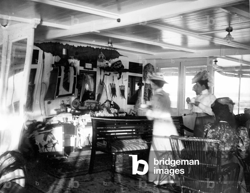 Egypt: Cook cruise, Nile village, tourists take the boat inside, 1900