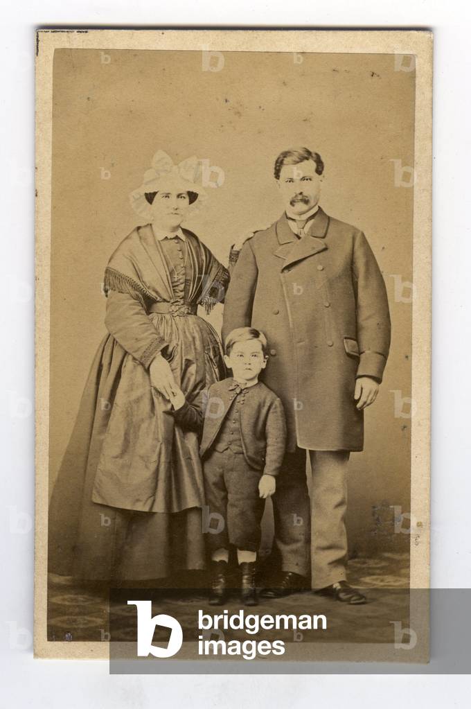 Angers, Maine-et-Loire (49), Pays de la Loire, France, Studio portrait of a family with a woman in traditional dress and headdress, 1865