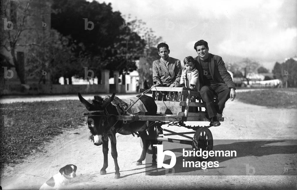 Tunisia: Tunisian family in a small cartte pulled by a donkey, 1947