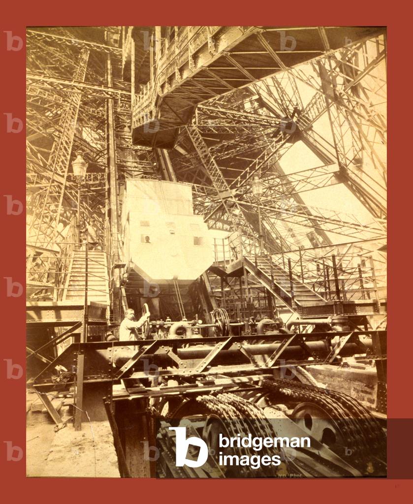 Eiffel Tower Machinery with a Man Beside the Wheel that Raises Elevator, During the Paris Exposition, France, Between 1887 and 1889, Napoleon Dufeu
