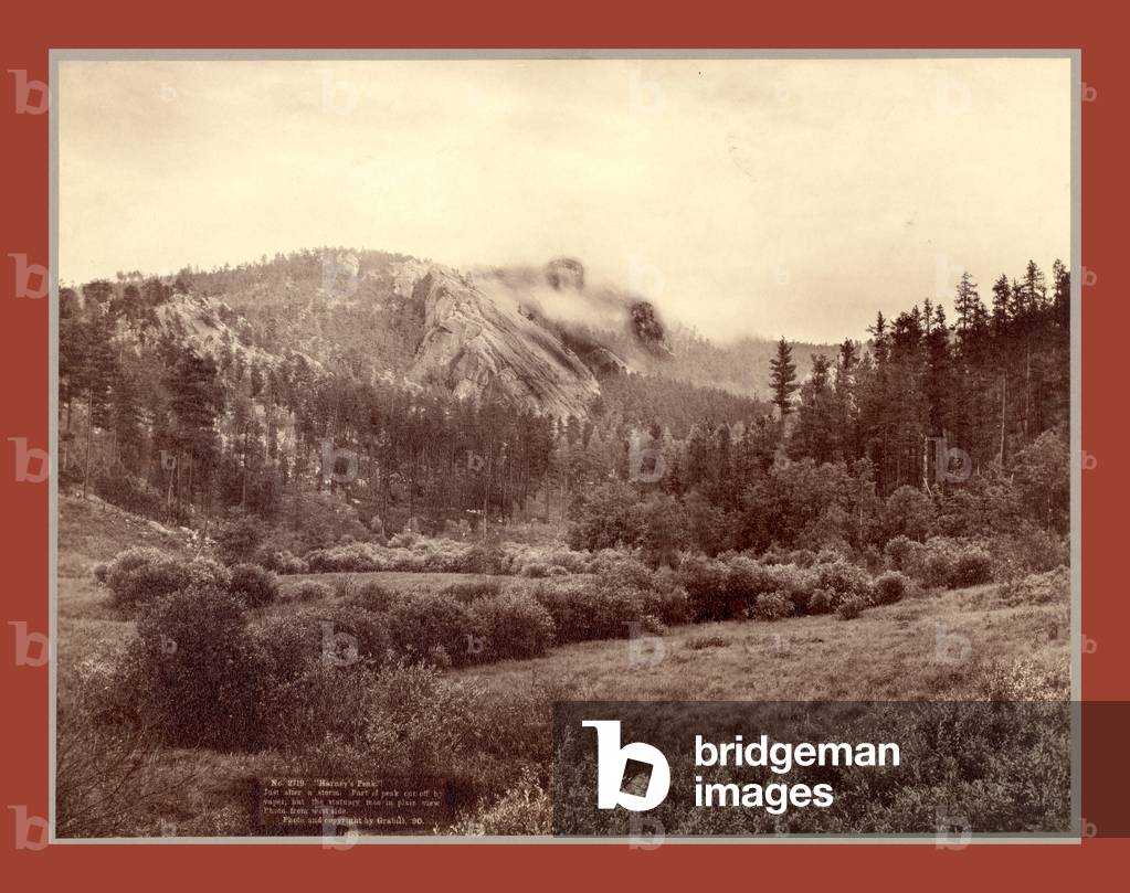 Harney's Peak. Just after a Storm. Part of Peak Cut Off by Vaper [Sic] But the Statuary Man in Plain View. Photo from West Side