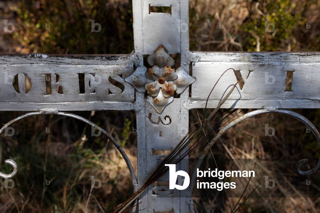 Castell-llebre. Church (Església de Mare de Déu). The churchyard. An iron cross.