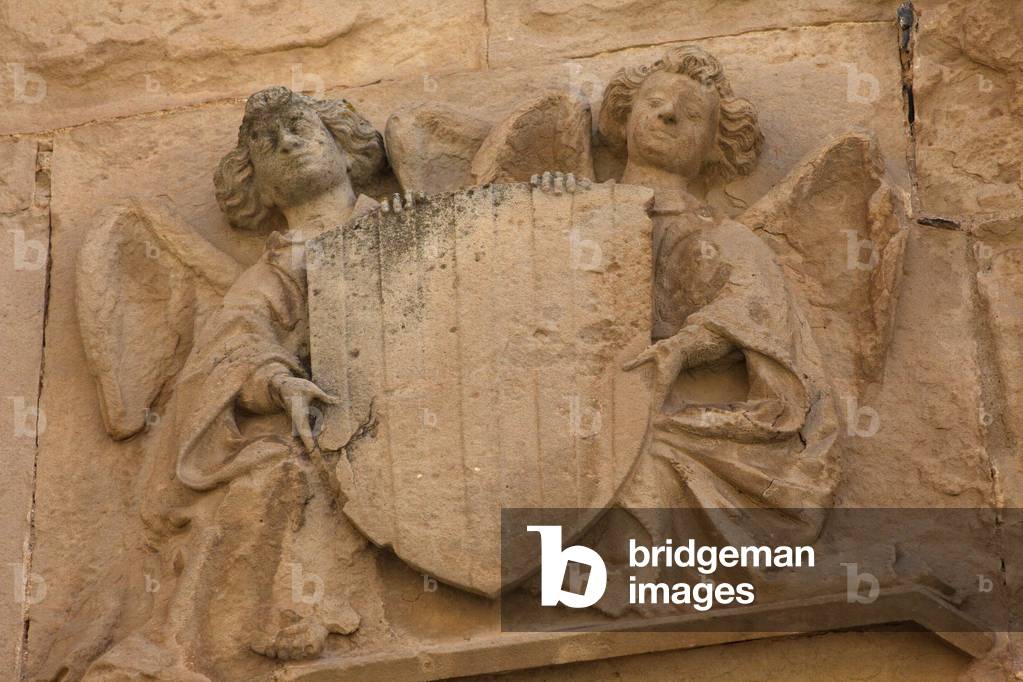 Monastery (Monestir de Poblet). The chapel (Capella de Sant Jordi. Façade. Detail. Two angels with an escutcheon. 1442.