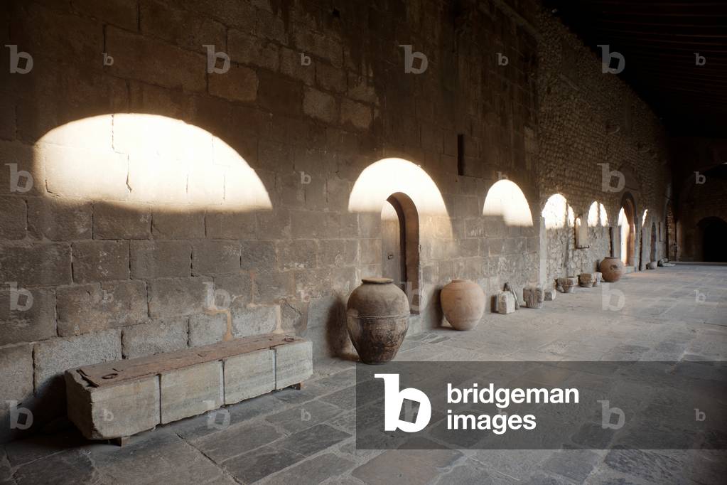 Cathedral. The cloister. A sarcophagus. Amphorae. Capitals.