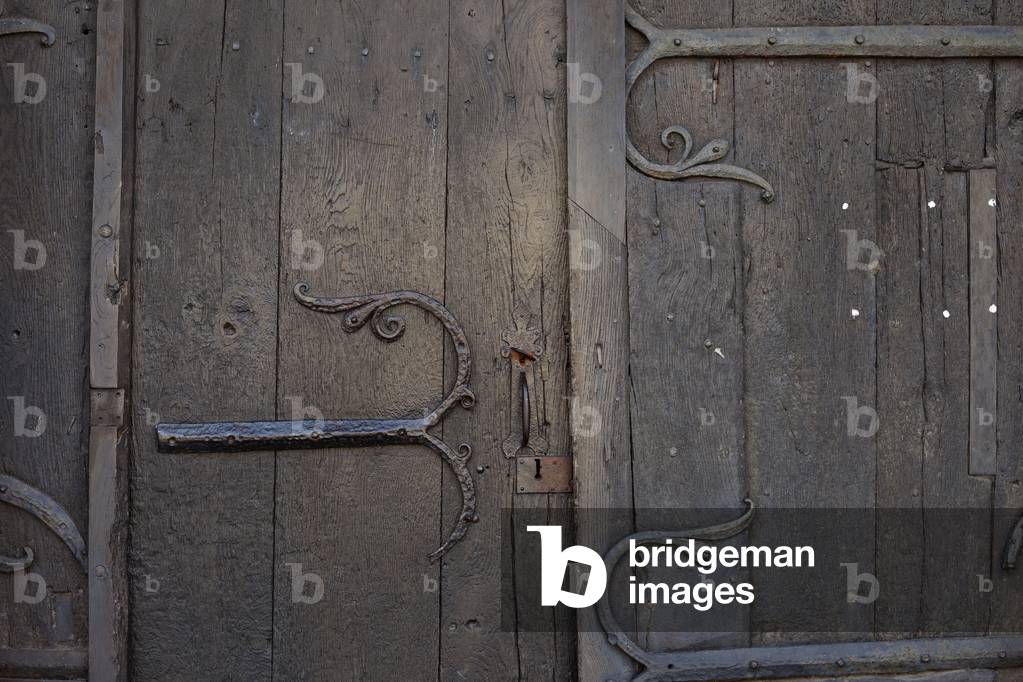 Collegiate church (Collégiale Saint-Pierre). Exterior. South portal. Detail. The door. Ironwork.
