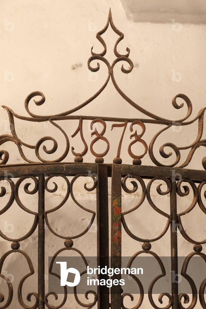 Parish church. Interior. The baptismal font. Detail of the fence.