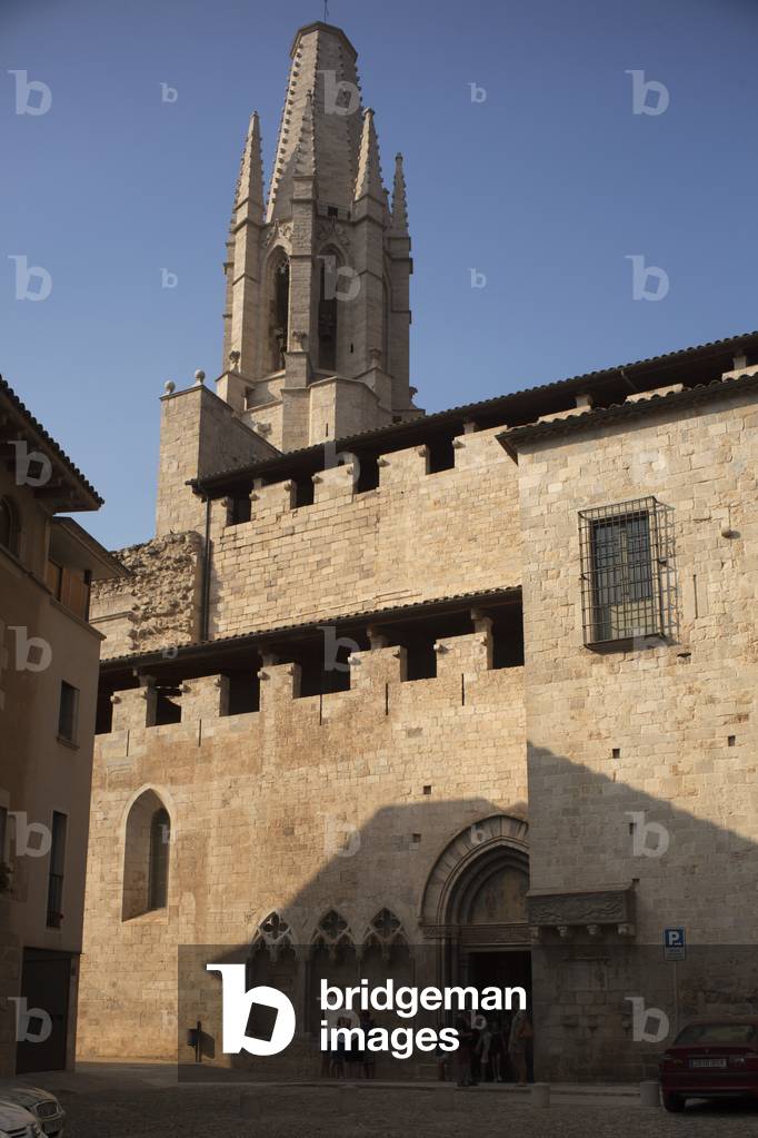 The church (Sant Feliu). Exterior. South entrance and the tower.