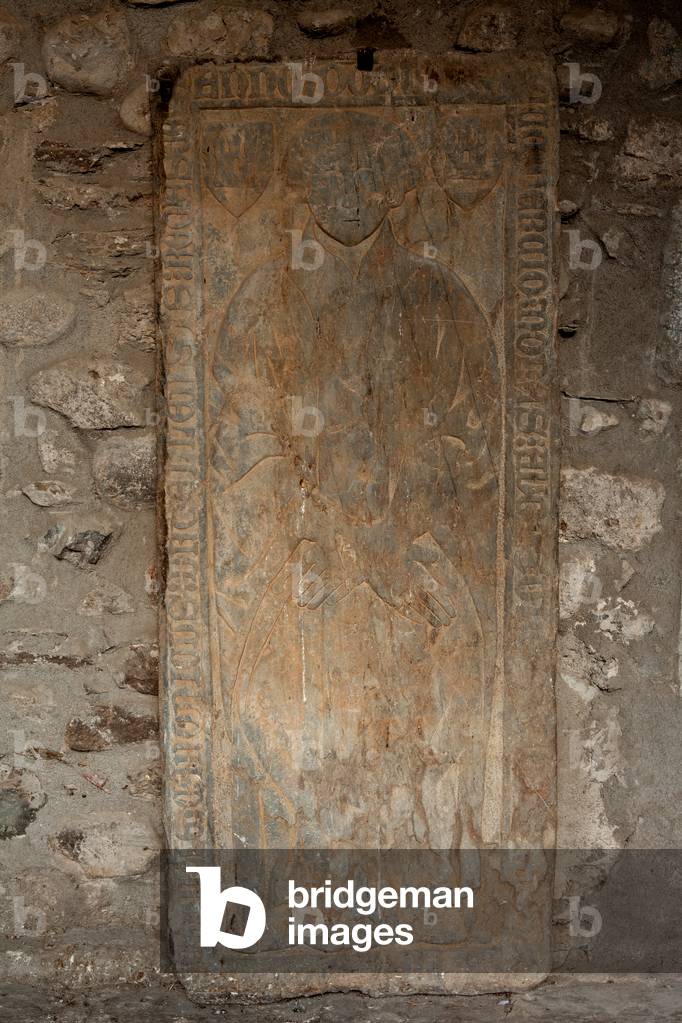 Cathedral. The cloister. A tombstone.