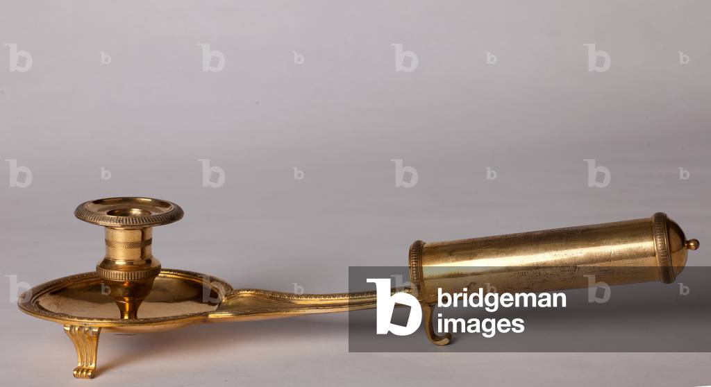 Candlestick. Gilt on copper. Begin 19th century. Empire style.