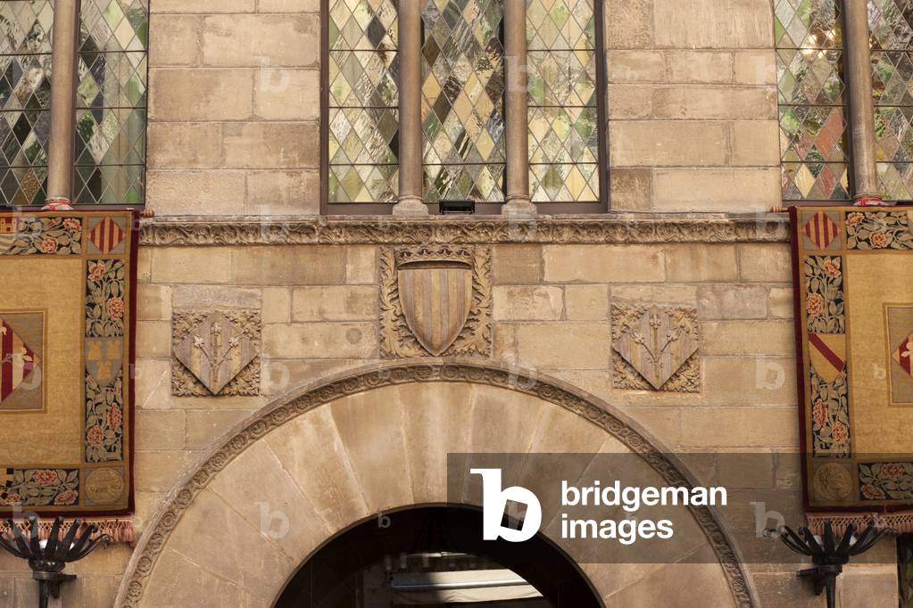 Town hall La Paeria. Façade. Exterior. Detail. Entrance. Romanesque-Gothic.