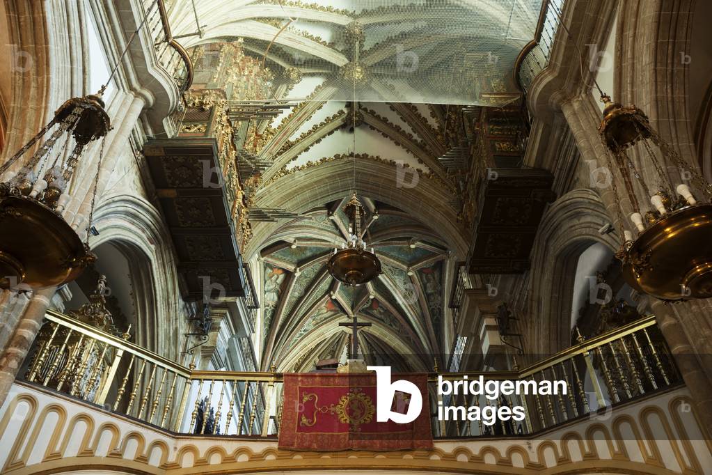 The basilical church. Interior. The nave, west part. The vaults, the organ. The tribune.