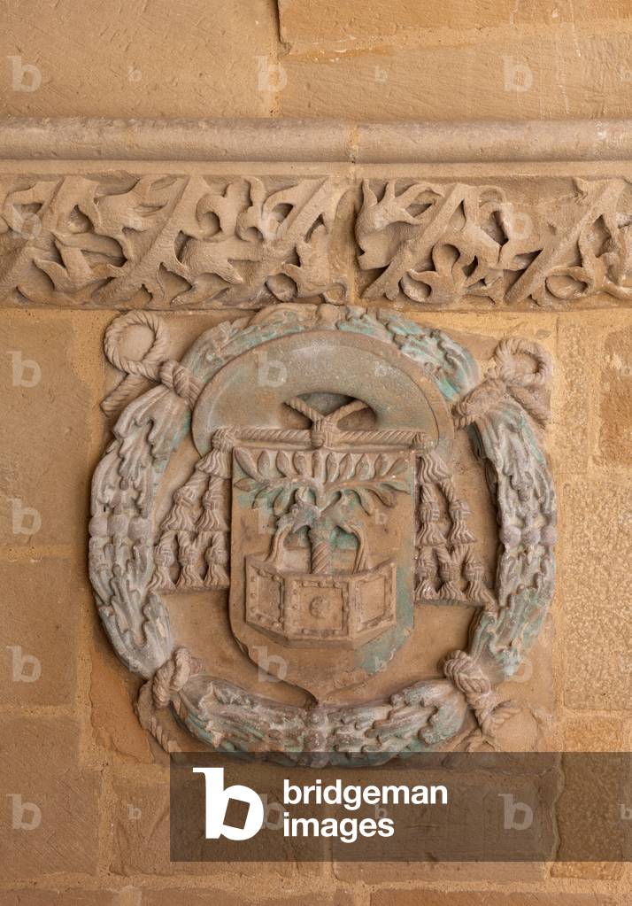 Church (Iglesia de Santa Maria de los Reales Alcázares. The cloister. Detail. A bas-relief, escutcheon.
