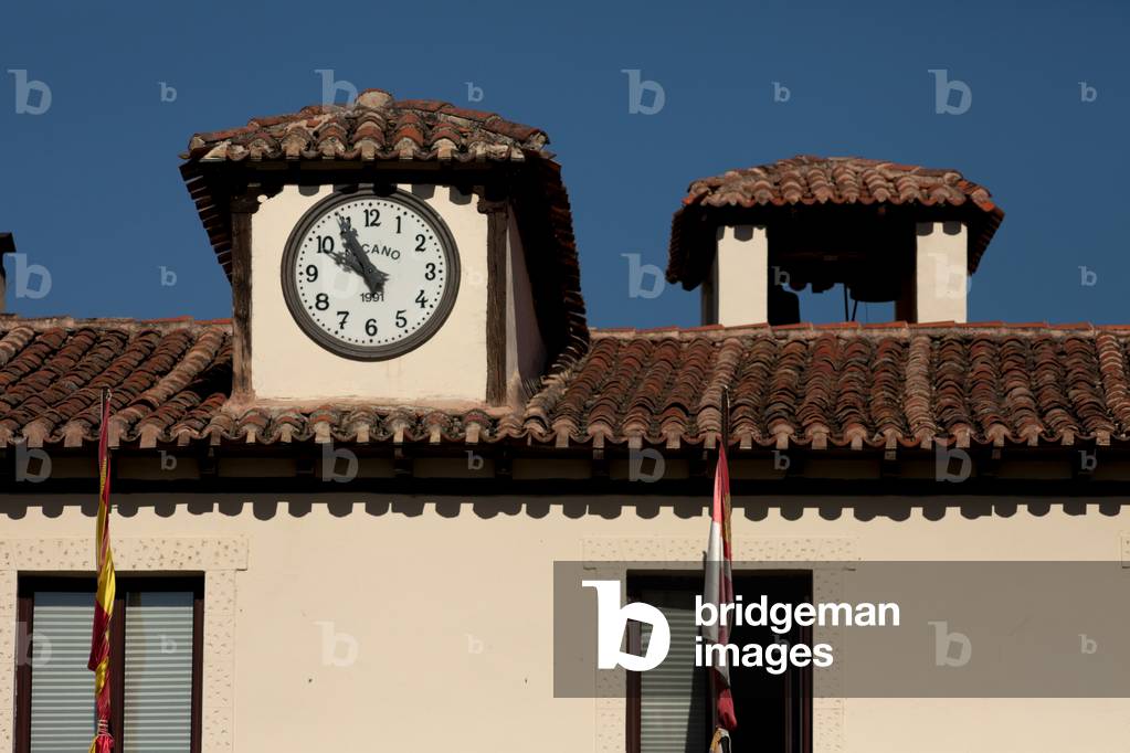 The town hall. Detail top with the clock.