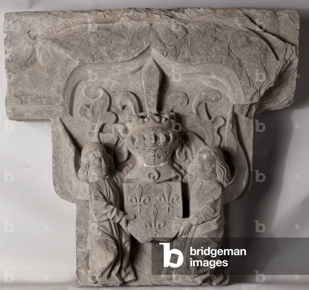 Voussoir of a fireplace (Claveau central de cheminée). Escutcheon with two angels. Stone. From the Museum of History and Archeology of Tournai (musée d'histoire et d'archéologie de Tournai). Origin unknown. Second half of 15th century.