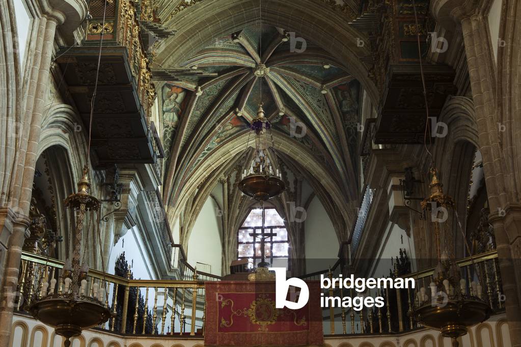 The basilical church. Interior. The nave, west part. The vaults, the organ. The tribune.