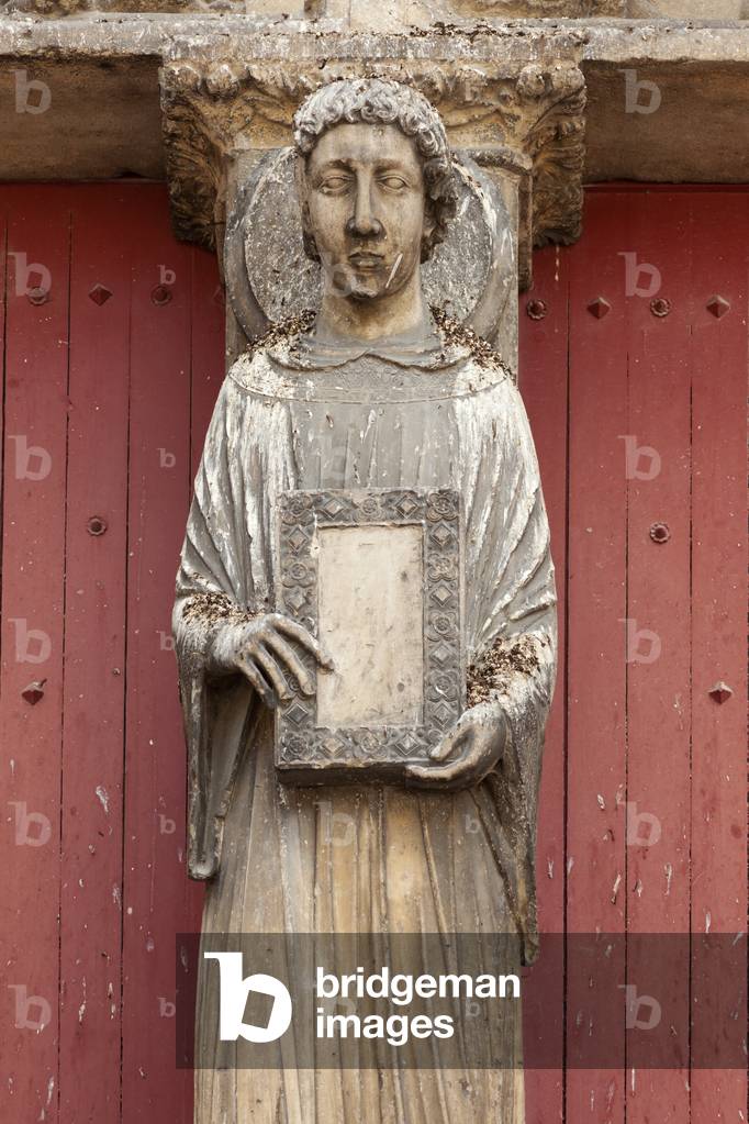Cathedral (Cathédrale Saint-Etienne). Exterior. West central portal. Detail. The trumeau. Statue (Statue de Saint Étienne). Bust. End 12th century.