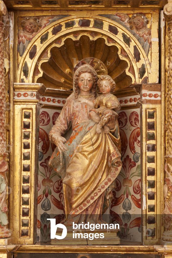 Parish church. Interior. A renaissance altar. Detail. A statue. Madonna with Child.