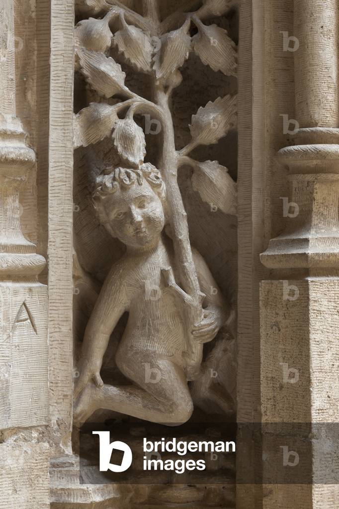 Church (San Juan de los Reyes (former monastery (Monasterio de San Juan de los Reyes). The cloister. Detail. Ornaments. A child (putti?) with a twig. End 15th century.