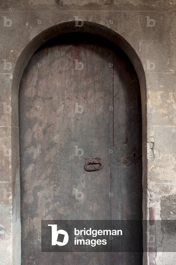 Cathedral. The cloister. A door.