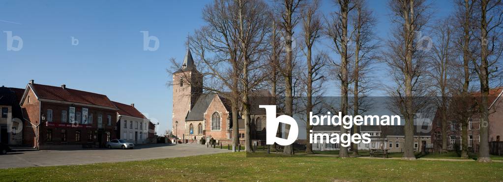 Hemelveerdegem. Parish church (Sint-Jan-Baptistkerk). Exterior. View of the village square (Dorpsplein).