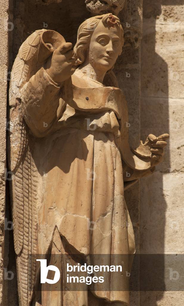 The cathedral. Exterior. East. Portal (Puerta de los Palos). Detail. Right doorjamb. A statue of an angel. Before 1520.