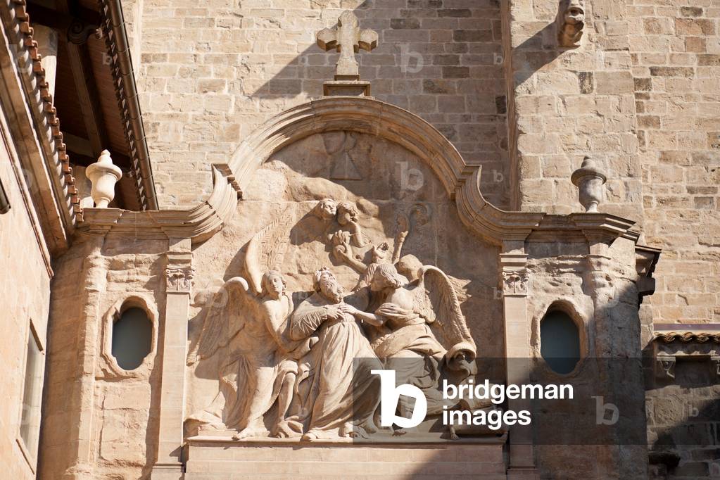 Cathedral. Exterior. West. The portico (Porta Sant Agustí). Detail. The pediment. Bas-relief. The saint in ecstasies. Baroque. 1780.