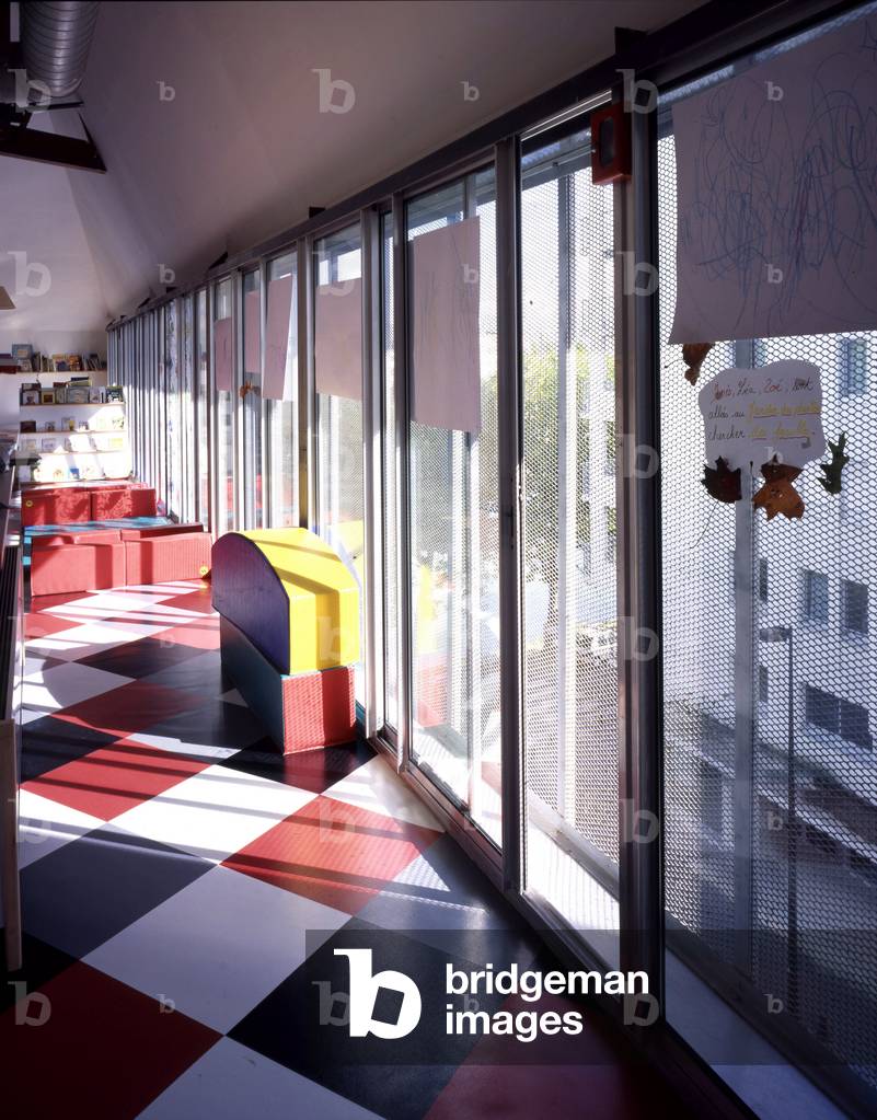 Creche du Lieu Unique in Nantes. Architecture by Patrick Bouchain, 1999. Destined for the manufacture of biscuits, the Lefevre-Utile factory was built at the beginning of the 20th century on the edge of the Saint-Felix Canal using modern techniques. Two Art Nouveau towers designed by Auguste Bluysen were added in 1909. The workshops were active until the beginning of the 1970s and in 1986 the factory was definitively closed. The tower was restored in 1998 by Jean-Marie Lepinay. And Patrick Bouchain will carry out the renovation while keeping the spirit of the place, that of a factory spontaneously transformed into a cultural place. Photography 2000