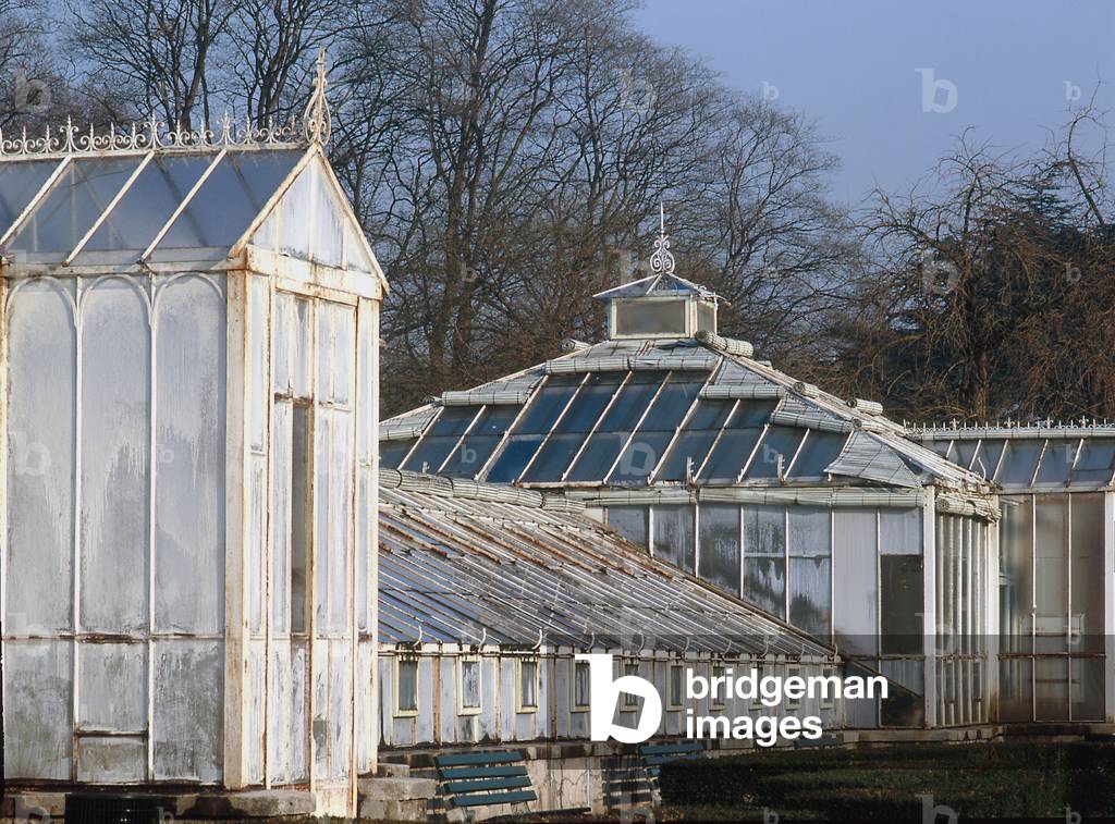 The greenhouses of the Tete d'or park in Lyon (Rhone). The Parc de la Tete d'Or has been part of Lyon's heritage since 1856. The name Tete d'Or comes from a legend that a treasor with a golden head of Christ was buried there. The realisation of this 117 hectare park is the work of landscape designer Denis Buhler. The iron greenhouses are very representative of the 19th century. They are home to one of the most important botanical gardens in Europe: 15,000 plants are listed here